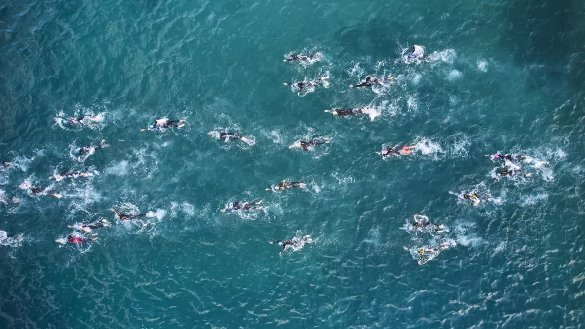 Athletes swimming during Ironman 70.3 Poreč triathlon in Croatia
