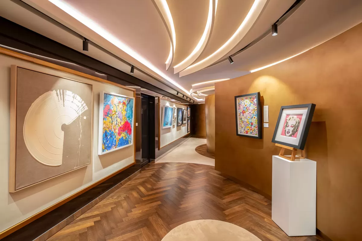Art gallery aboard Explora Journeys ship featuring contemporary paintings and classic masterpieces by renowned artists.