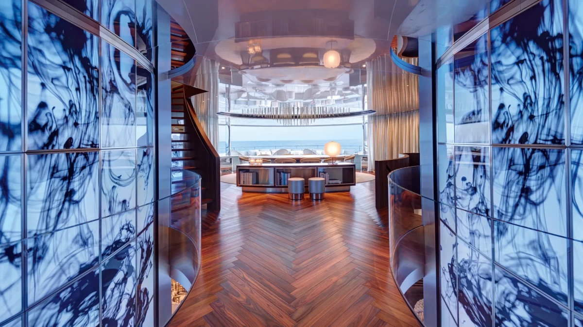 Cinematic glass walls aboard the superyacht Savannah, creating a seamless visual connection between the interior and the surrounding sea