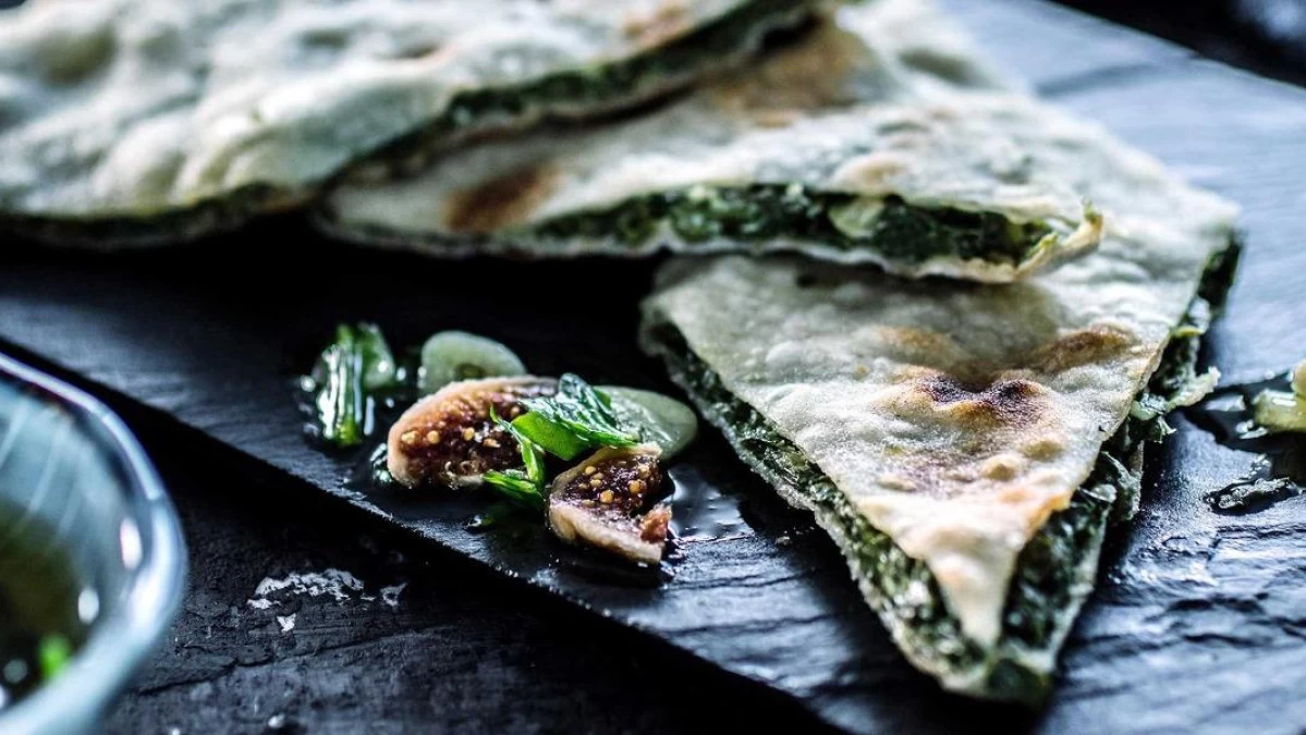 Traditional Croatian food Soparnik, savory pie filled with Swiss chard, olive oil and garlic, a cultural specialty from Poljica near Split