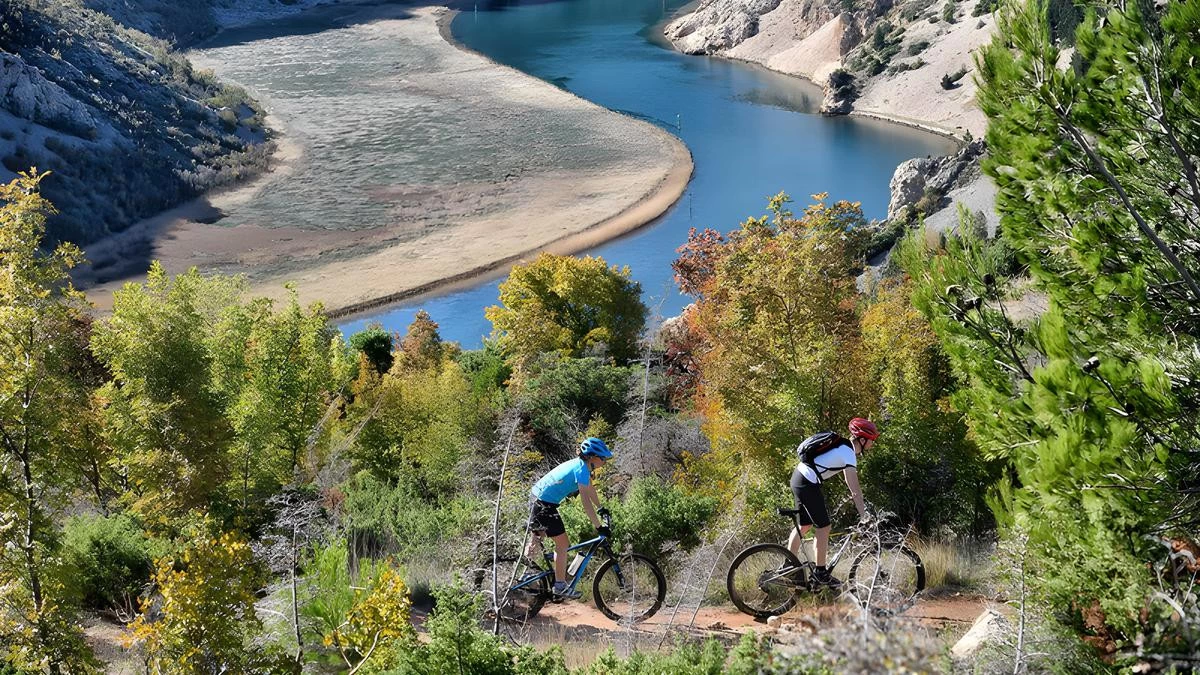 Cyclist exploring the Zadar region in Croatia, passing historic towns, olive groves, and Adriatic coastline – Cycling Croatia