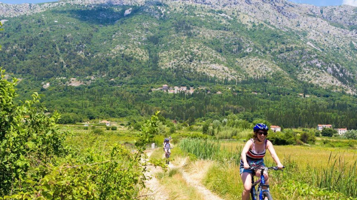 Cyclist exploring the Dubrovnik region in southern Croatia, riding past medieval walls, coastal trails, and panoramic viewpoints of the Adriatic and nearby islands – Cycling Croatia