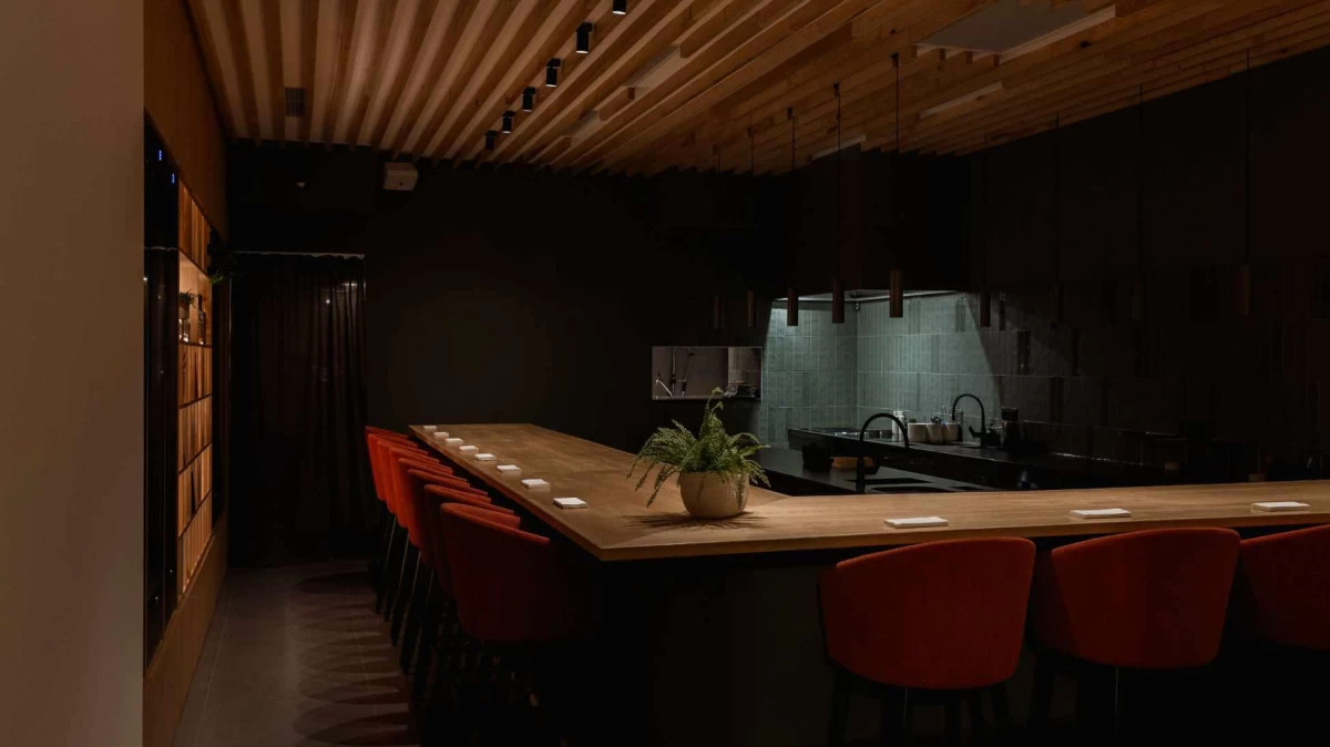 Fine dining at Krug Split with open kitchen concept, L-shaped counter seating, local ingredients, and curated wine pairings.